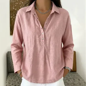 Close-up view of a dusty pink loose casual long-sleeved button shirt with a lapel collar