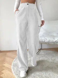 Close-up detail showing texture of white high-waisted corduroy wide-leg pants for women