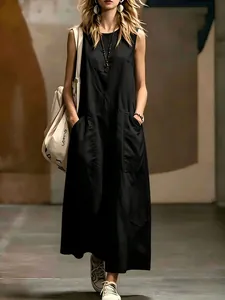 Elegant black sleeveless maxi dress with side pockets and minimalist aesthetic.