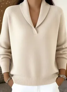 Close-up of elegant cream V-neck knit sweater with stylish lapel collar.