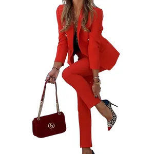 Elegant red two-piece fashion suit for women featuring a fitted blazer and matching trousers