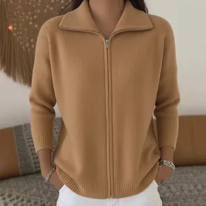High-quality close-up of a camel zip-up knit cardigan sweater with elegant ribbed texture