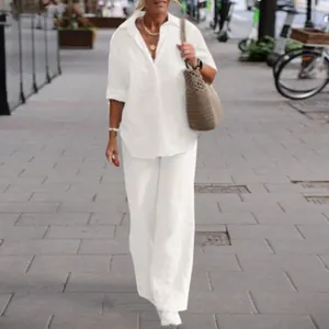 Elegant white two-piece linen set with long-sleeved shirt and casual wide-leg pants