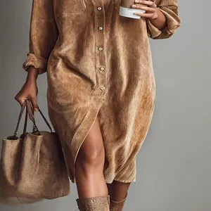 Macro detail of brown corduroy long-sleeved loose shirt dress with buttons