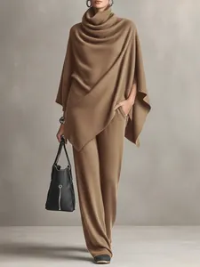 Detail view of the soft texture on camel turtleneck poncho and wide-leg pants set