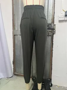 Back view of women's high-waisted olive green jogger pants with elastic waistband