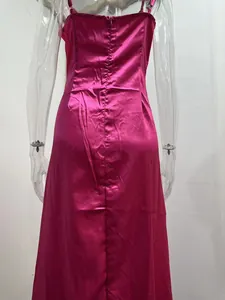 Back view detail of a sexy fuchsia satin slip dress showing slim fit and zipper closure