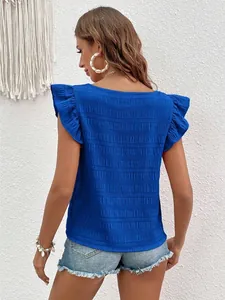 Detail view of blue ruffled sleeve top with textured fabric and square neck