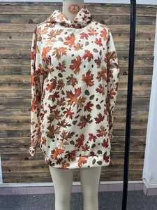 Close-up detail of oversized hoodie featuring vintage autumn maple leaf print pattern