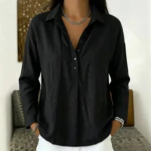 Close-up of a women's casual black long-sleeved button-down shirt with a collar