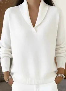 Detail of white V-neck knitted sweater with elegant ribbed texture and shawl collar