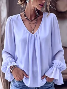 Close-up of the V-neck and elegant pleats on this light purple loose-fit long sleeve blouse