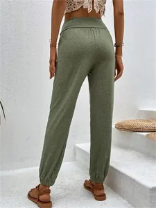 Back view of women's olive green high-waisted joggers with elastic cuffs for a casual fit.
