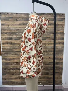 Side view of women's vintage maple leaf print loose hooded sweatshirt on mannequin