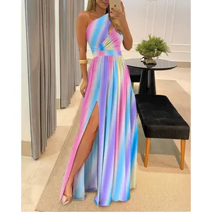 Detailed view of vibrant rainbow gradient one-shoulder maxi dress featuring high slit design.