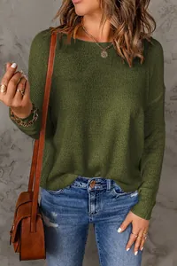 Close-up of olive green knit texture on this casual long-sleeve women's sweater.
