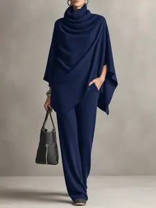 Navy blue turtleneck poncho and wide-leg pants two-piece set for women's autumn winter wear.