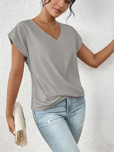 Detail shot of elegant gray V-neck T-shirt with stylish twist hem for women.