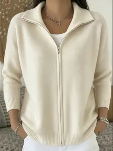 Detail view of a cream zip-up knit cardigan with a ribbed lapel collar and casual style