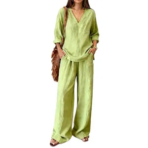 Elegant light green washed cotton two-piece set with V-neck top and wide-leg pants