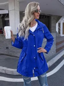 Detail showing the fit and style of a blue mid-length hooded raincoat for women