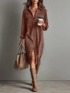 Close-up of a women's brown corduroy long-sleeved button-down shirt dress with pockets