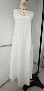 White sleeveless bohemian vacation dress shown on a professional dress form mannequin
