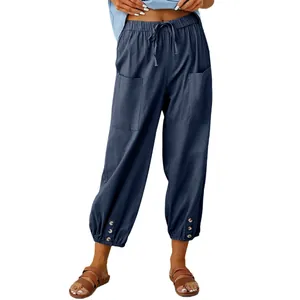 Losse katoenen linnen broek voor dames met hoge taille, wijde pijpen en knoopdetails.