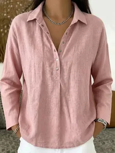 Elegant women's casual loose-fitting pink long-sleeve linen shirt with buttoned lapel collar