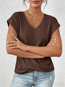 Detailed view of an elegant women's brown V-neck T-shirt featuring a twisted hem