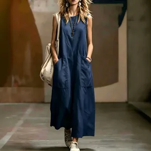Elegant navy blue sleeveless maxi dress with large front pockets for a minimalist summer look