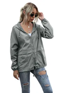 Detail view of lightweight gray waterproof hooded hiking jacket with zip closure