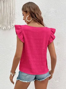 Back view of pink ruffled sleeve blouse with textured smocking and square neckline
