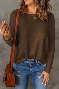 Detailed view of women's brown textured knit sweater with casual fit and crew neck