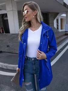 Detail view of royal blue hooded mid-length raincoat with zipper and snap buttons