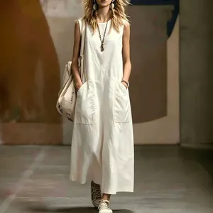 Elegant white sleeveless maxi dress with pockets for women's summer street style.