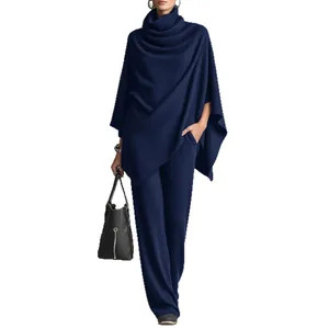 Elegant navy blue turtleneck poncho and wide-leg pants set for autumn and winter fashion