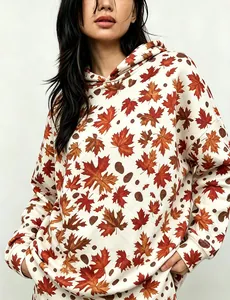 Detailed view of women's vintage maple leaf printed oversized hoodie with drop shoulders