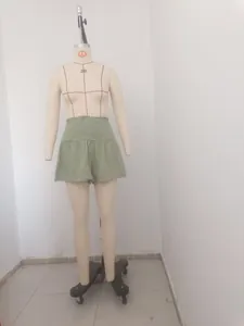 High waisted cotton linen skorts for women in olive green presented on a mannequin