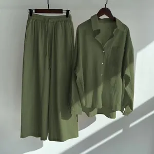 Two-piece cotton linen set featuring olive green shirt and matching wide-leg pants