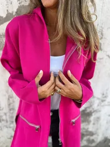 Detail view of a vibrant magenta hooded jacket with functional silver zipper pockets.