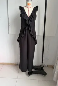 Chic black sleeveless linen jumpsuit with ruffled V-neck for summer resort wear