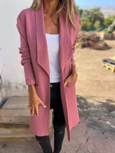 Detail of pink mid-length lapel knitted cardigan coat with functional side pockets