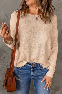 Stylish women's beige long sleeve knit sweater with soft texture and crew neck.