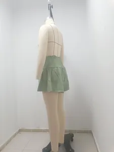 Side view of light green high waist ruffled skirt pants on a mannequin detail shot
