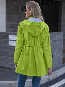 Back view of women's lime green hooded rain jacket with drawstring waist and striped lining