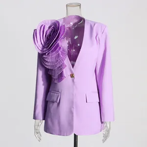 Detail of a lavender women's blazer featuring a large 3D pleated floral decoration on shoulder.