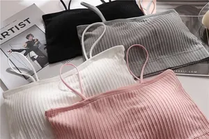 Close-up of four colorful seamless ribbed bandeau bras with thin straps