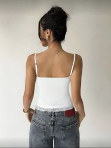 Detailed back view of a white slim fit camisole featuring delicate lace trim at the hem