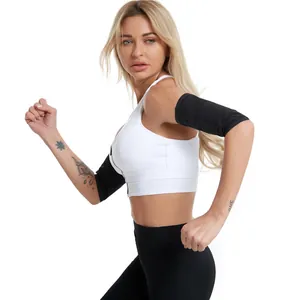 Detailed side view of a fit woman wearing black compression sweat arm trimmers for exercise